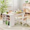 A children's art table and chair set in a bright, well-lit room with a large plant and a dresser in the background. Produktbild-Vorschau