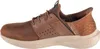 Side view of a brown Skechers slip-on shoe. Voir les images du produit