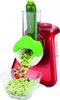 A close-up shot of a red electric grater with a zucchini being grated into a glass bowl. Produktbild-Vorschau