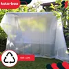 A transparent protective cover draped over an outdoor structure, likely a greenhouse or garden furniture, with greenery in the background. Produktbild-Vorschau