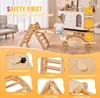 A child plays on a wooden climbing structure indoors, with various safety features highlighted in inset images. Voir les images du produit