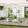 A greenhouse filled with plants on a wooden deck. Voir les images du produit
