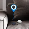 Two Samsung Galaxy SmartTags are shown on a couch, one black and one white. A blue location pin graphic hovers over the black SmartTag, indicating its location. Náhľad obrázku produktu