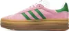 A side view of a pink Adidas Gazelle Bold sneaker with green stripes and a gum sole. Produktbild-Vorschau