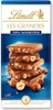 A stack of Lindt chocolate bars with hazelnuts on a blue background. Náhľad obrázku produktu