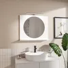 A modern bathroom vanity with a white sink, black faucet, and a white framed mirror with integrated lighting. Podgląd zdjęcia produktu