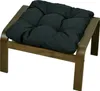 A close-up studio shot of a dark gray cushion on a wooden ottoman. Produktbild-Vorschau