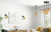 A living room with a yellow sofa, a wooden cabinet, and several pendant lights and wall lamps with bamboo shades. Podgląd zdjęcia produktu