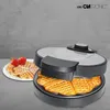 A waffle maker with waffles and strawberries on a plate, set against a textured gray background. Náhľad obrázku produktu