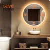 A modern bathroom setting with a round LED mirror above a sink. Náhled obrázku produktu