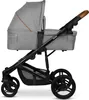 A side view of a gray baby stroller on a white background. Anteprima dell’immagine prodotto