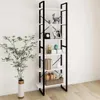 A tall, narrow bookshelf with white shelves and a black metal frame, decorated with various items, stands against a white wall next to a potted plant. Podgląd zdjęcia produktu