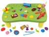 A play table with various clay molds and tools scattered on its surface and around it. Produktbild-Vorschau