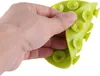 A hand is holding a green silicone mat with suction cups. Anteprima dell’immagine prodotto