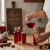 12er Set Glasflaschen 100 ml eckig mit Schraubverschluss – Produktbild-Vorschau 6