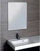 A bathroom sink with a mirror above it, set against a dark tiled wall. Náhľad obrázku produktu