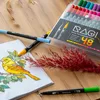 A set of RAGI dual-tip marker pens is displayed on a wooden surface, alongside a drawing of a bird and some dried foliage. Produktbild-Vorschau
