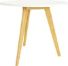 A round white table with three wooden legs against a white background. Podgląd zdjęcia produktu