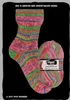 A knitted sock and a ball of yarn are displayed against a black background. The sock is folded over at the cuff, and the yarn is a ball with a label. Produktbild-Vorschau