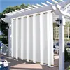 Outdoor curtains hanging on a pergola over a patio. Produktbild-Vorschau