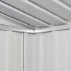 Close-up view of the interior corner of a metal shed, showing the roof beams and wall panels. Náhľad obrázku produktu