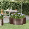 An outdoor patio scene with a table, chairs, and raised garden beds filled with hydrangeas. Náhľad obrázku produktu