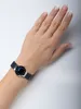A woman's wrist wearing a Bering watch. Náhľad obrázku produktu