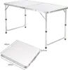 A white folding table is shown in two states: unfolded and folded, with dimensions indicated. Anteprima dell’immagine prodotto