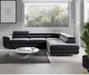 A modern living room with a large sectional sofa, coffee table, and a framed picture on the wall. Produktbild-Vorschau