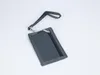 A gray wallet with a clear window and a wrist strap is shown against a white background.