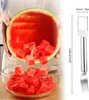 A person is holding a hollowed-out watermelon over a glass bowl, with cut watermelon pieces falling into the bowl. A kitchen utensil is shown to the right with dimensions indicated. Produktbild-Vorschau