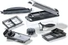 A collection of kitchen cutting and slicing tools, including a mandoline slicer, a dicer with a collection container, a peeler, and various blade attachments, arranged on a white background. Anteprima dell’immagine prodotto