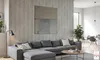 A modern living room with a sectional sofa, coffee table, and artwork on a wood-paneled wall. Anteprima dell’immagine prodotto