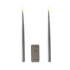 Two LED taper candles and a remote control are displayed against a white background. Produktbild-Vorschau