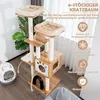 A multi-level cat tree with scratching posts and platforms, shown indoors next to a litter box and a sofa. Produktbild-Vorschau