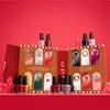 A holiday-themed advent calendar for OPI nail polish, shaped like a gingerbread house with doors revealing different nail polish colors. Anteprima dell’immagine prodotto