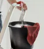 A person is using a cleaning bucket with a red cloth. Produktbild-Vorschau