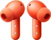 A pair of orange wireless earbuds are shown against a white background. Náhled obrázku produktu