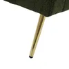 A close-up of the leg of a green sofa with a gold-colored metal leg. Anteprima dell’immagine prodotto