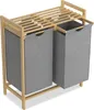 A laundry hamper with two compartments and a wooden top shelf.
