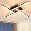 A modern black LED ceiling light with crystal accents, mounted on a white ceiling. Produktbild-Vorschau