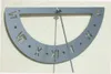 A metal sundial with Roman numerals mounted on a textured wall. Produktbild-Vorschau