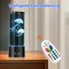 A jellyfish lamp and a remote control are placed on a wooden table next to a curtain. Produktbild-Vorschau
