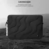 A black laptop sleeve with a wavy pattern is placed on a rocky, dark surface, with a blurred mountainous background. Podgląd zdjęcia produktu