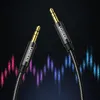 Two UGREEN AUX cables with gold-plated connectors against a dark background with colorful sound wave graphics. Anteprima dell’immagine prodotto