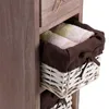 A close-up of a wooden storage unit with woven baskets holding folded towels. Produktbild-Vorschau