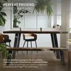A dining table and bench set with industrial-style metal legs in a well-lit room with plants. Náhľad obrázku produktu