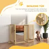 A wooden pet gate is set up in a doorway, with a dog sitting nearby. The background shows a living room interior. Produktbild-Vorschau