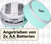A mint-colored mini vacuum cleaner with its battery compartment open, showing where two AA batteries are inserted. A text overlay provides product information. Anteprima dell’immagine prodotto