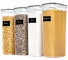 Four clear plastic food storage containers filled with different food items, labeled with black chalkboard-style labels. Produktbild-Vorschau